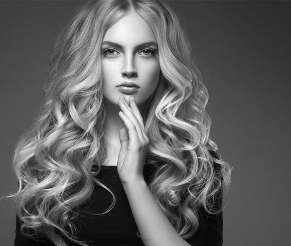 Add some bounce with temporary hair curling.